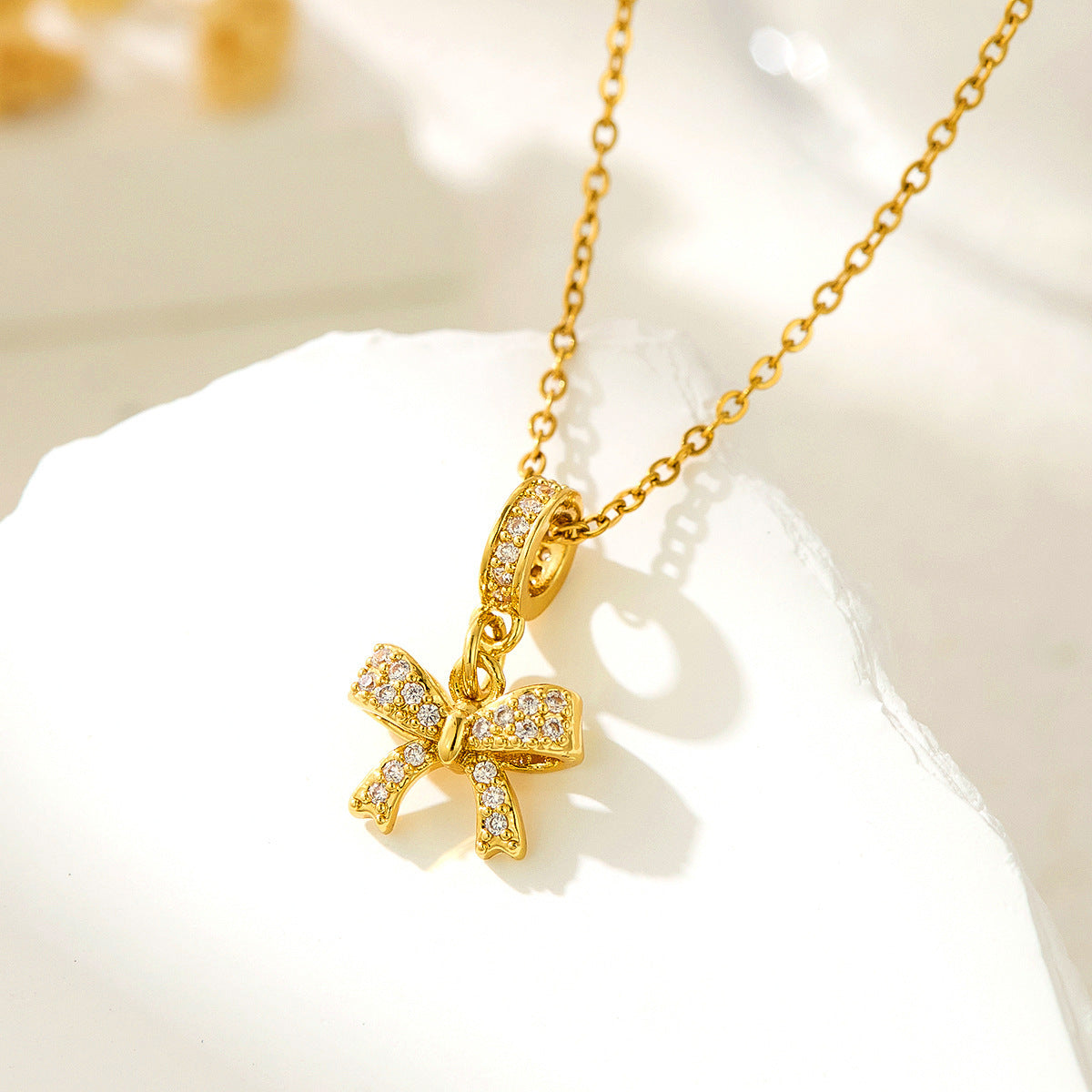 Bow Adorned Zircon Pendent